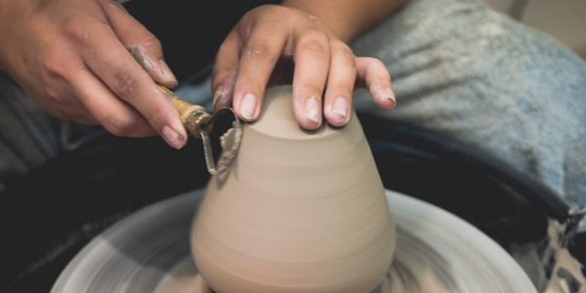Student creating a ceramic bowl